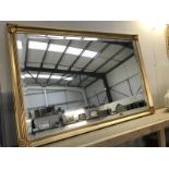 A large gilt framed bevel edged mirror ****Condition report**** 94cm long x 63cm