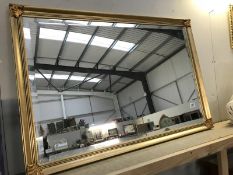 A large gilt framed bevel edged mirror ****Condition report**** 94cm long x 63cm