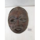 Yoruba hardwood mask: A Yoruba hardwood mask from the Congo. A tribal elder with a beard.