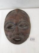 Yoruba hardwood mask: A Yoruba hardwood mask from the Congo. A tribal elder with a beard.