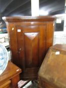 A mahogany corner cupboard on stand.