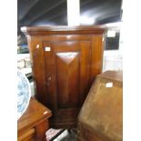 A mahogany corner cupboard on stand.