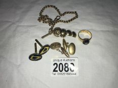 A collection of gold items including a pair of Masonic cufflinks, watch chain,