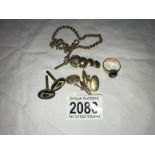 A collection of gold items including a pair of Masonic cufflinks, watch chain,