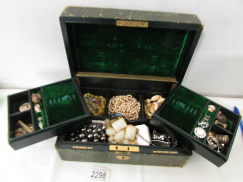 A good mixed lot of costume jewellery in an a/f vintage jewellery box.