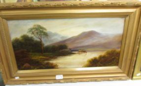 A gilt framed oil oncard 'Cattle watering in a Highland loch', signed T wood. Image 60 x 30 cm.