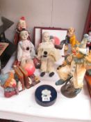 A collection of porcelain clowns etc.