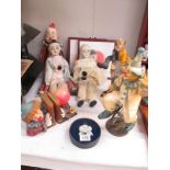 A collection of porcelain clowns etc.