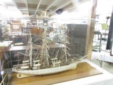 A superb hand built model of "The Denmark" in a plastic display case measuring 68 x 113 x 35 cm.