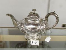 An ornate 19th century silver teapot, London Hall mark, 1834/35, makers mark I.L, S.L, C.L.