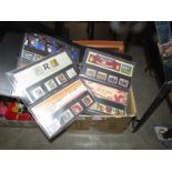 A box of stamp albums, mint sets, presentation packs etc.