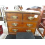 A small 2 over 2 mahogany chest of drawers.
