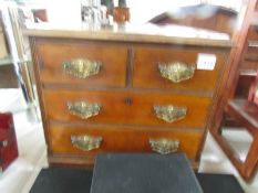 A small 2 over 2 mahogany chest of drawers.