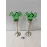 A pair of silver and green glass specimen vases, hall marked Birmingham 1918/19.