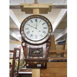 A Victorian mahogany drop dial wall clock with mother of pearl inlay.