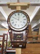 A Victorian mahogany drop dial wall clock with mother of pearl inlay.