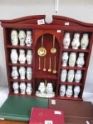 A Lenox porcelain spice rack collection including 24 spice jars, salt and pepper and spoons,