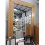 A large rustic oak framed mirror with square pegged corners