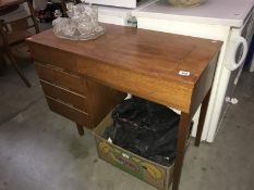 A teak desk/sewing table (missing sewing machine)