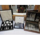 A boxed set of 12 knives/forks with mother of pearl handles (1 knife missing) and other boxed