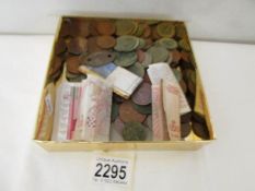 A mixed lot of coins and bank notes.