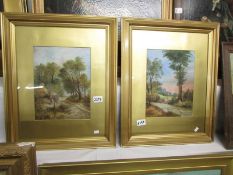 A pair of gilt framed and glazed 19th century oil on board paintings 'Woman on fence with church in