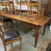 A good quality modern dining table with granite inset to top.