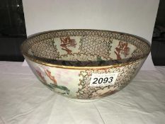 A Chinese bowl featuring horse riders pictured to centre