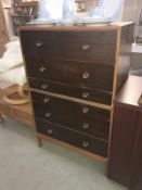 A dark wood stained retro chest of drawers