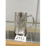 An engraved silver tankard hall marked for London 1873/74, approximately 167 grams.