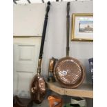 2 copper warming pans and copper and brass miners lamps