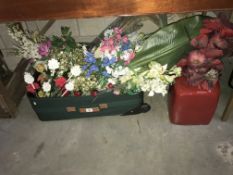 A large quantity of fake flowers & a large red vase