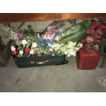 A large quantity of fake flowers & a large red vase