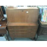 A retro teak bureau