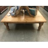 A large pine low coffee table