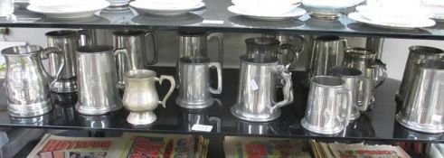 A quantity of silver plated tankards etc.