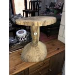 A carved tree trunk garden table