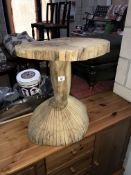 A carved tree trunk garden table