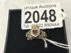 An Irish claddagh ring stone set in gold ****Condition report**** Size is