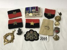 A set of miniature medals, buttons,