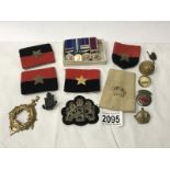 A set of miniature medals, buttons,