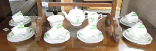 A 21 piece art deco tea set (1 tea cup a/f).
