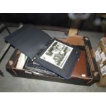 A box of miscellaneous ephemera including postcards.