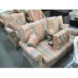 A 2 piece suite consisting of 2 seater settee and a matching chair