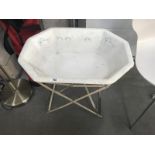 A vintage enamel baby bath on folding iron stand ****Condition report**** Stand has