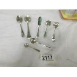 7 items of silver including salt/mustard spoons, approximately 85 grams.
