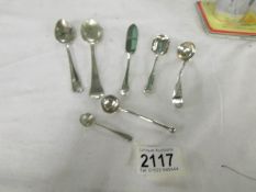 7 items of silver including salt/mustard spoons, approximately 85 grams.