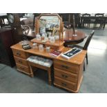 A solid pine double pedestal desk/dressing table with mirror and stool
