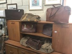 A quantity of vintage leather and canvas holdalls, briefcase, suitcase etc.