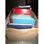 A box of stamp albums and stamps.